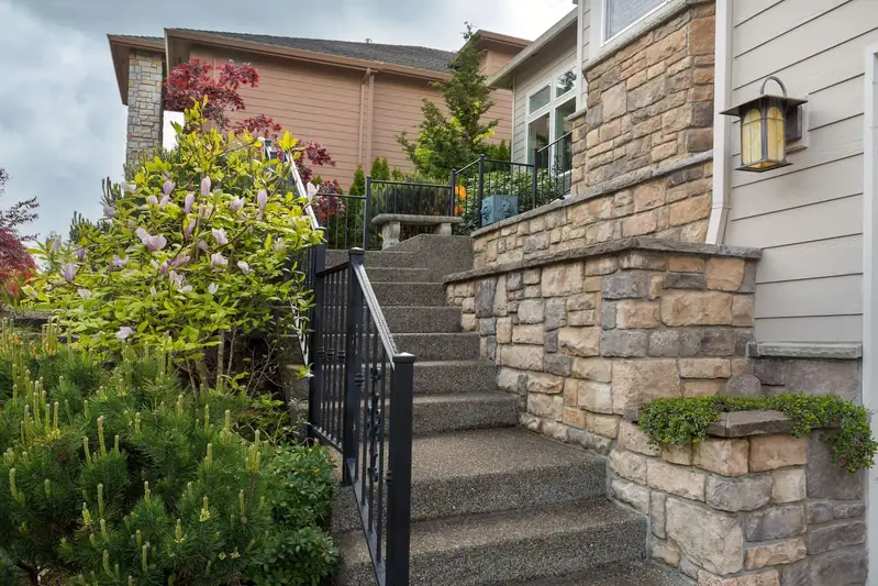 Stone steps with custom ornamental iron railings and scrollwork in San Diego