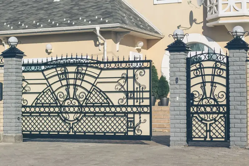 Heavy-duty estate driveway gate with brick masonry pillars in San Diego
